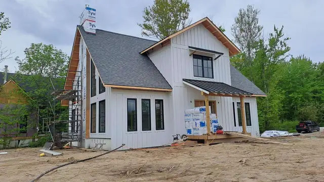 Newly built modern farmhouse-style home with board-and-batten siding